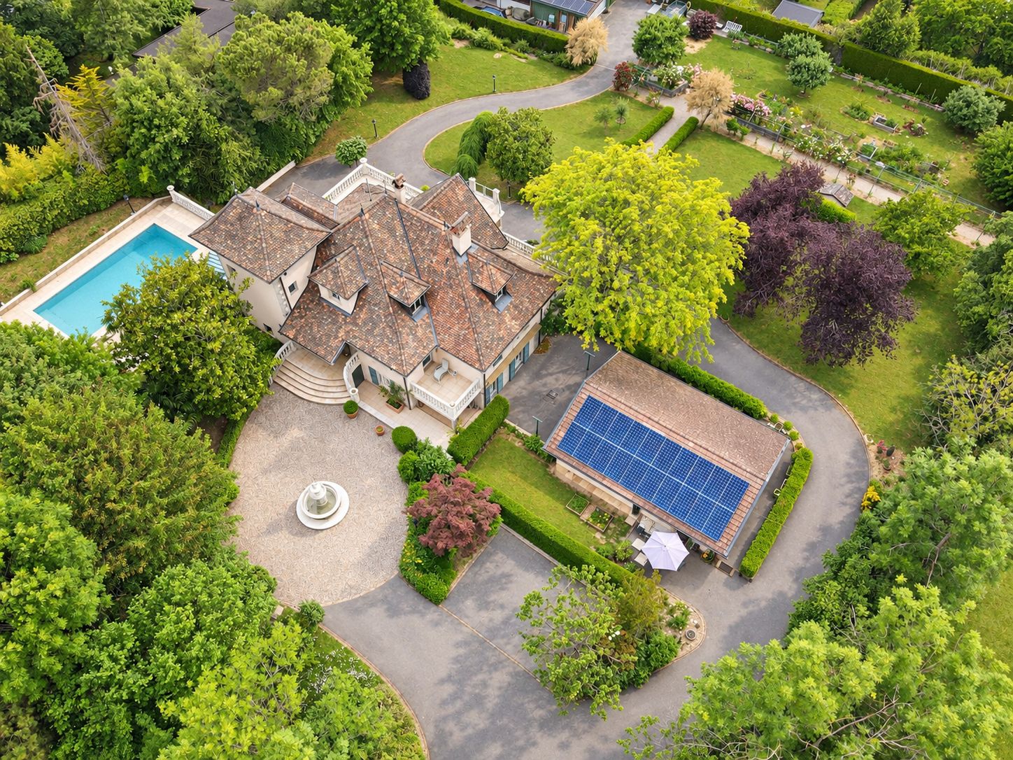 The courtyard, fountain, annexe and gardens from above. Enhanced photograph.